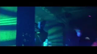 man with gun in neon lit room — John Wick