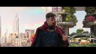 Man in red cape with city skyline — Doctor Strange 2