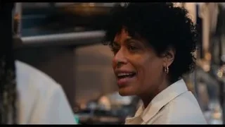 Woman in kitchen with eyes closed — The Bear