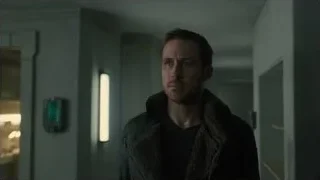 man with beard in dimly lit hallway — Blade Runner 2049