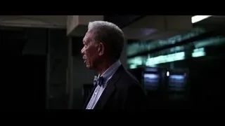 Older man in suit standing in dim room — Batman: The Dark Knight