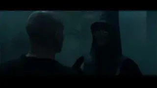 Person in hooded cloak and hat in eerie environment — Harry Potter and the Goblet of Fire