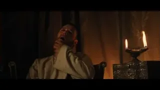 man in white shirt with candles — Gladiator