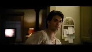 Man watching TV in dimly lit living room — Superman: Man of Steel