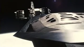 Futuristic spaceship flying through space — Interstellar