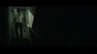 man walking down dark staircase with cane — John Wick