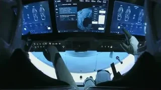 person in spaceship cockpit with monitors — Elon Musk: Return to Space