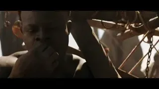 shirtless African man in battle stance outdoors — Gladiator