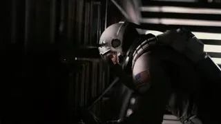 man in futuristic suit with American flag — Interstellar