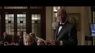 Man in suit giving speech to group — Batman