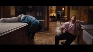 man kneeling in kitchen — The Wolf Of Wall Street