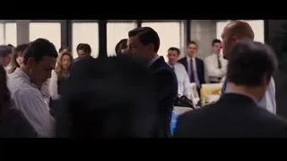 Man speaking to group in conference room — The Wolf Of Wall Street