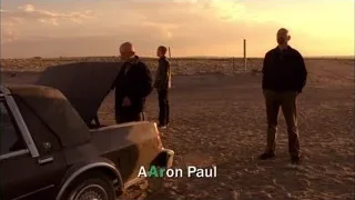 men inspecting car in desert sunset — Breaking Bad