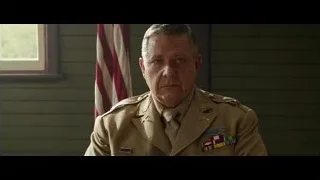 man in military uniform with American flag — Hacksaw Ridge