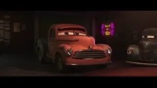two animated cars in garage — Cars 3