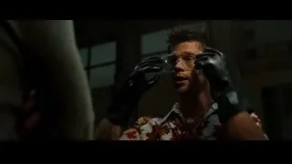 man in Hawaiian shirt holding a gun — Fight Club