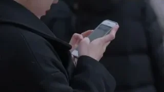 hands holding a smartphone — Screened Out