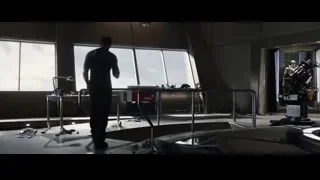 Man holding object in concrete room — Iron Man 3