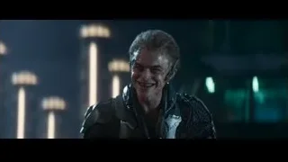 man in futuristic suit holding gun in city — The Amazing Spider Man 2