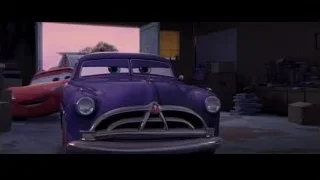 Two cars parked in a garage — Cars