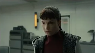 woman in vest at computer desk — Blade Runner 2049