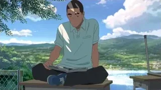 young man reading Japanese newspaper on bench — Your Name