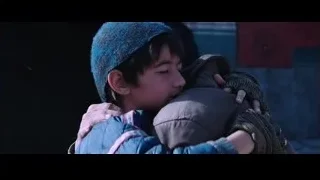 boy hugging man by red wall — Iron Man