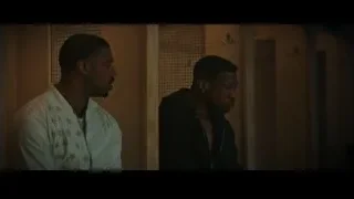 Two men in dimly lit room — Creed 3
