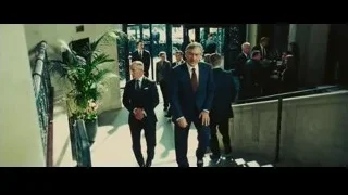 two men shaking hands in formal setting — Limitless