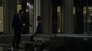 two men in suits on sidewalk at night — Suits