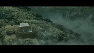 people at castle on cliff overlooking water — Harry Potter and the Goblet of Fire