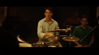 young men playing drums and guitar — Whiplash