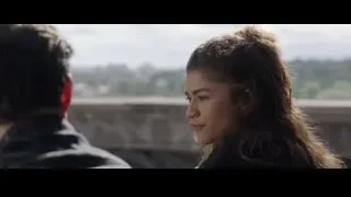 woman looking at cityscape from balcony — Spiderman: No Way Home