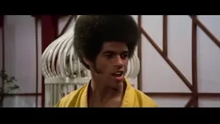 young man with afro and yellow shirt — Bruce Lee: Enter The Dragon