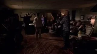 group of people conversing in dim room — Breaking Bad