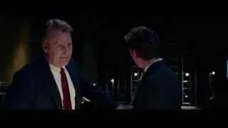 two men in suits in dimly lit room — Steve Jobs