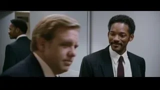 two men in suits talking in hallway — The Persuit of Happyness