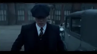 Man in suit walking on street with vintage car — Peaky Blinders