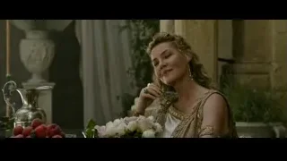 woman in golden dress with flowers — Gladiator 2