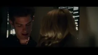 Man and woman in dimly lit room — The Amazing Spider Man 2