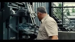 man standing in front of large machine — Jurassic World