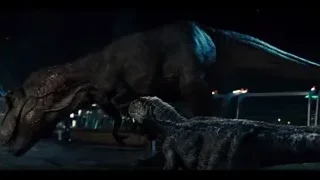 two dinosaurs fighting in city at night — Jurassic World