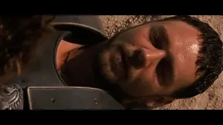 man with beard eyes closed on sand — Gladiator
