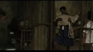 man kneeling with goat in small room — Life of Pi