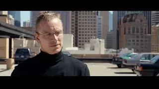 man speaking on rooftop with city skyline — Steve Jobs