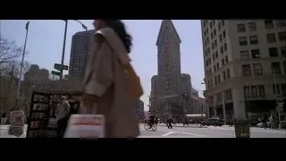 Busy downtown city street with red skyscraper — Spider Man 2