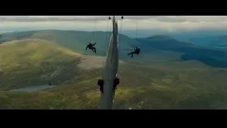 People rappelling from helicopter over mountains — Batman: The Dark Knight Rises
