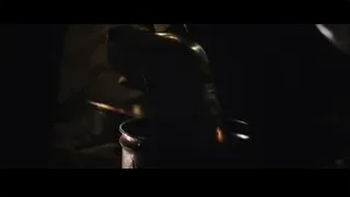 metal pot with tongs stirring contents — Iron Man