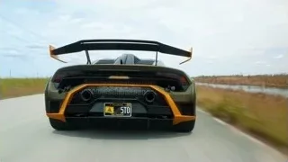 Lamborghini sports car driving on road — Sports Cars
