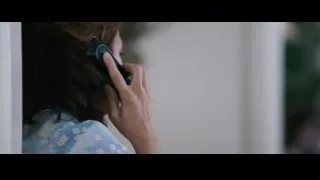 person's hand holding phone to ear — The Big Short